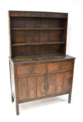Lot 48 - An unusual early 20th century oak dresser with...