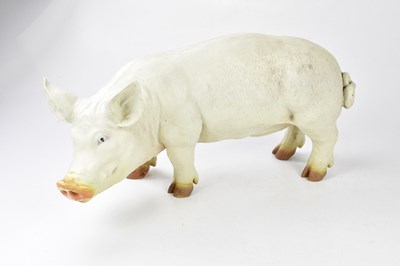 Lot 1097 - A large resin model of a standing pig, length...