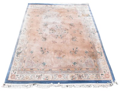 Lot 356 - A Chinese wool carpet, worked with an floral...