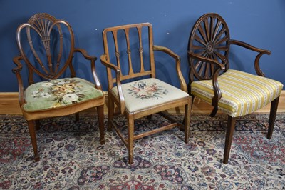 Lot 113 - A George III style mahogany wheel back chair,...
