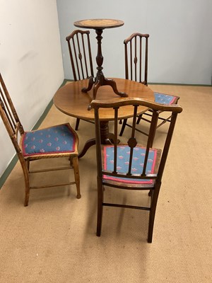 Lot 538 - A set of four chairs and two tables, largest...