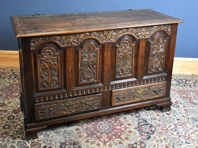 Lot 272 - A 19th century carved oak mule chest, the...