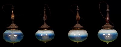 Lot 2183 - A set of four Arts and Crafts pendant lights...