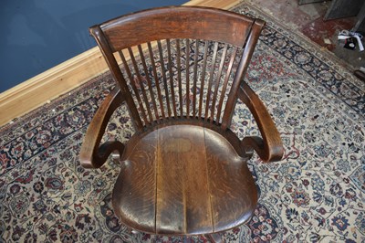 Lot 75 - A 1920s oak office chair with splat back.