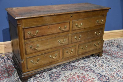 Lot 273 - An 18th century oak mule chest with hinged top...