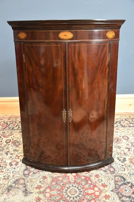 Lot 302 - A Georgian inlaid mahogany bowfronted corner...