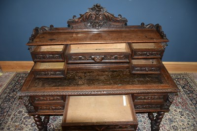 Lot 24 - A 19th century Flemish style carved oak desk...