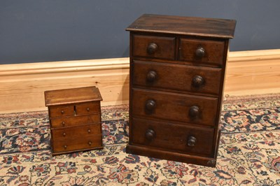 Lot 247 - A 20th century miniature chest of two short...