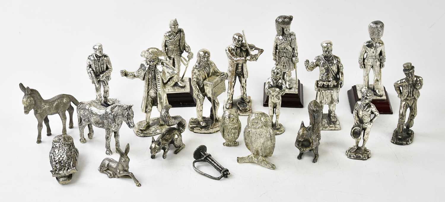 Lot 1013 - A collection of silver plated figures and