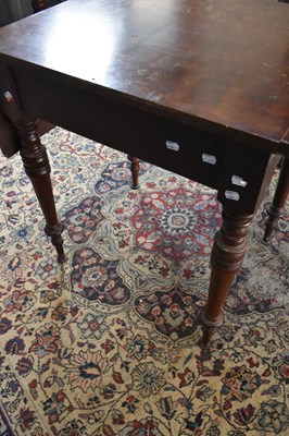 Lot 99 - An early 20th century drop-leaf table with...