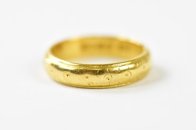 Lot 127 - A 22ct yellow gold wedding band, size K,...