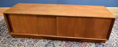 Lot 145 - G-PLAN; a teak low sideboard, with two sliding...