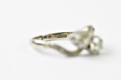 Lot 69 - An 18ct white gold diamond crossover, size L,...