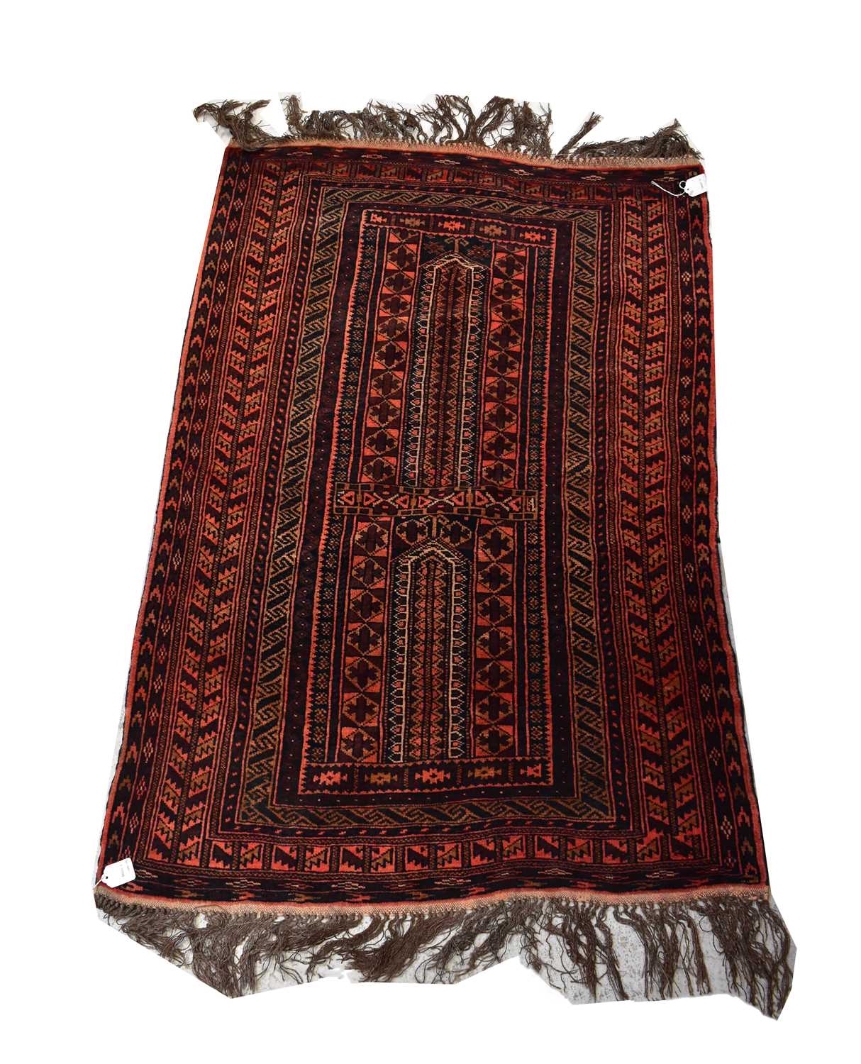 Lot 83 - A Tchik Tchack Tu hand knotted red ground...