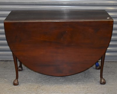 Lot 93 - An early 20th century mahogany drop-leaf table...
