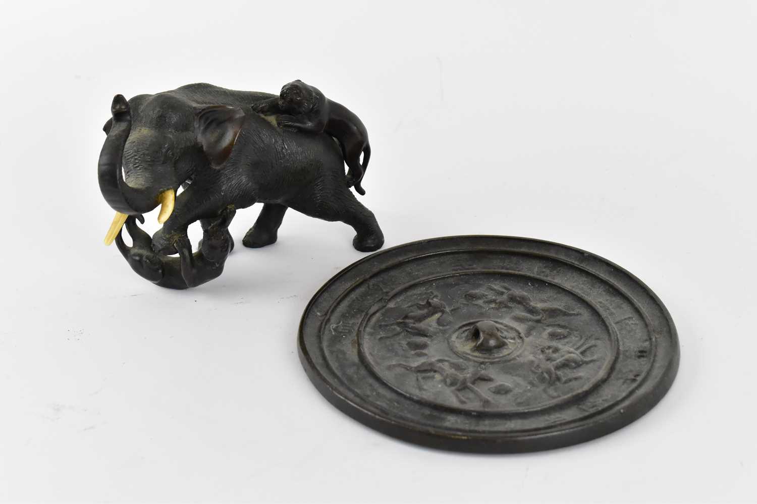 Lot 619 - A small Japanese Meiji period bronze figure of...