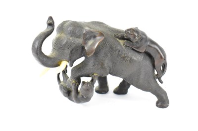 Lot 619 - A small Japanese Meiji period bronze figure of...