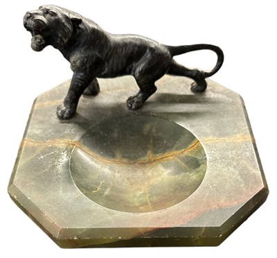 Lot 673 - An onyx dish, surmounted by a spelter figure...