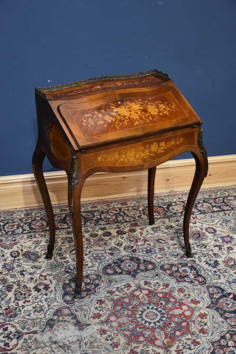 Lot 10 - A French inlaid kingwood and rosewood Louis XV...