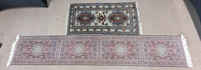 Lot 184 - A Bombay runner with floral decoration on a...