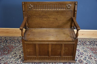 Lot 14 - A 1950s oak monk's bench with panelled front,...