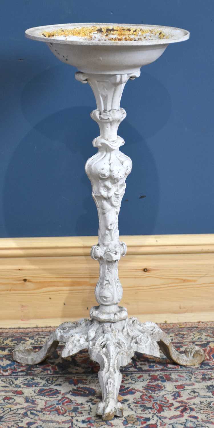 Lot 191 - A white painted cast iron bird bath on