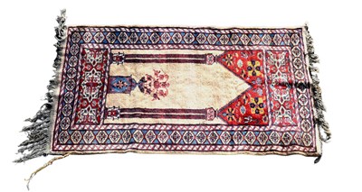 Lot 357 - A small Caucasian rug with central medallion...