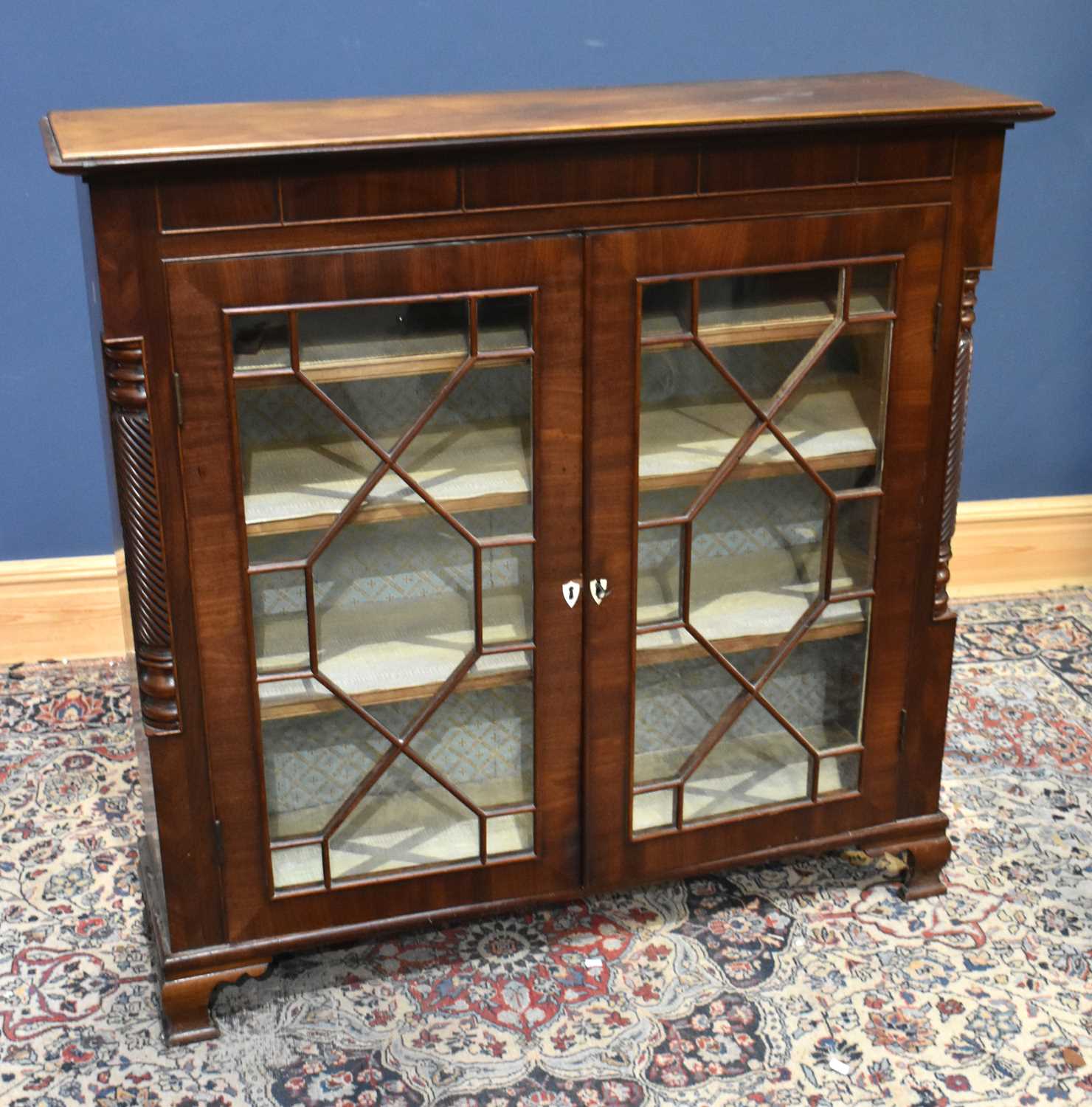 Lot 47 - A 19th century mahogany twin door cabinet, the...