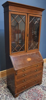 Lot 63 - An Edwardian inlaid mahogany bureau bookcase...