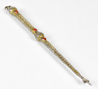 Lot 1064 - A white and yellow metal scroll reader with...