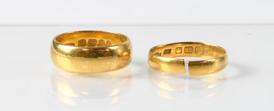 Lot 719 - Two 22ct gold wedding bands, sizes N and O...