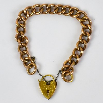 Lot 804 - A 9ct yellow gold bracelet with padlock clasp,...