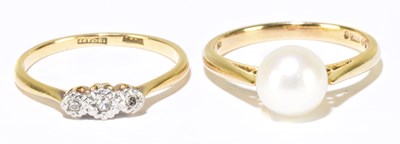 Lot 1195 - An 18ct yellow gold illusion set three stone...