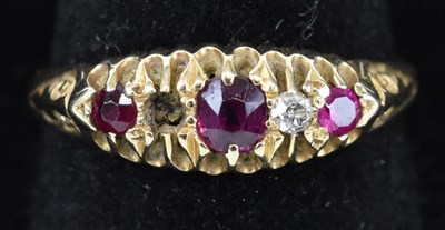 Lot 808 - A yellow metal diamond and ruby set ring set...