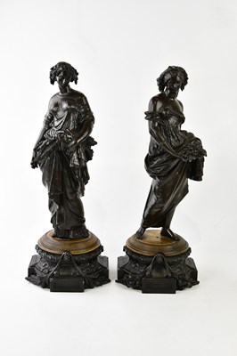 Lot 1176 - A pair of reproduction bronzed spelter figures...