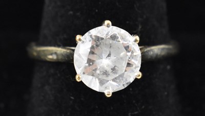 Lot 855 - A 9ct yellow gold solitaire ring, set with...