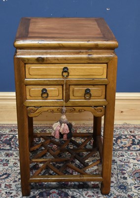 Lot 214 - A modern Chinese elm side cabinet with three...