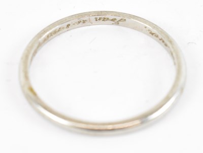 Lot 812 - A platinum wedding band, size N, approx 2.2g.