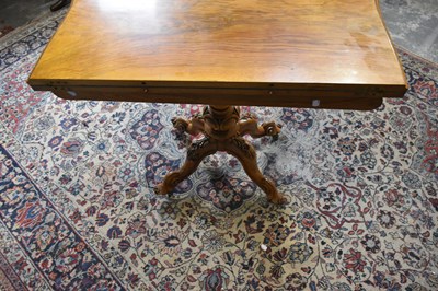 Lot 25 - A Victorian walnut serpentine card table with...