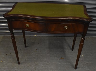 Lot 53 - A reproduction mahogany two drawer games table,...