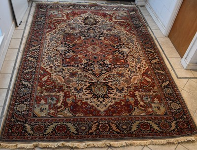 Lot 105 - A large Heriz Kadjar rug with floral design,...