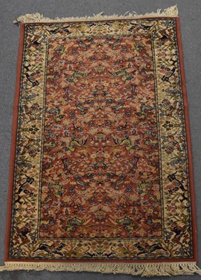 Lot 141 - A red ground Super Kashan carpet with cream...