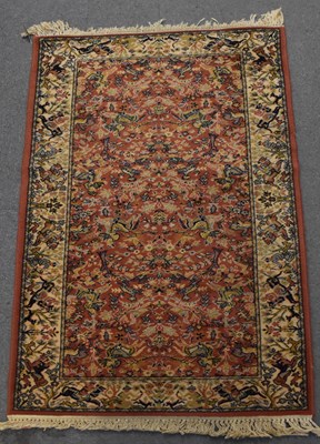 Lot 115 - A red ground Super Kashan carpet with cream...