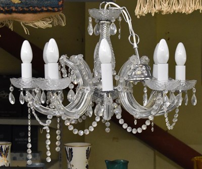 Lot 137 - A modern eight branch cut glass chandelier,...