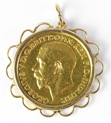 Lot 853 - A George V sovereign 1912, in a 9ct gold mount,...