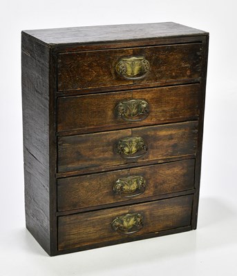 Lot 1032 - A stained pine miniature chest of five drawers,...