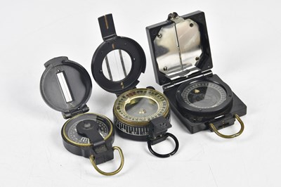 Lot 1633 - T G COMPANY; a military compass, a similar...