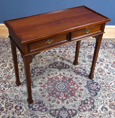 Lot 124 - A modern mahogany two drawer side table on...