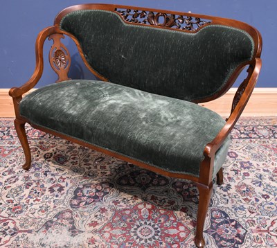Lot 32 - An Edwardian carved mahogany two seater settee...