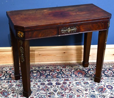 Lot 39 - A 19th century mahogany fold-over tea table...